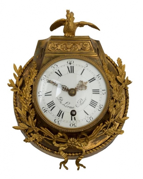 A Louis XVI Ormolu Cartel Clock